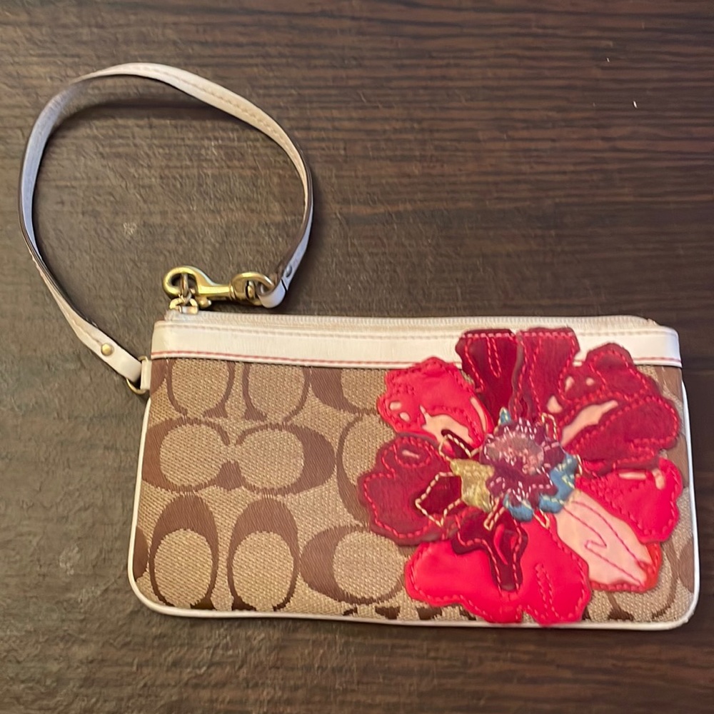Coach wristlet with leather and suede flower